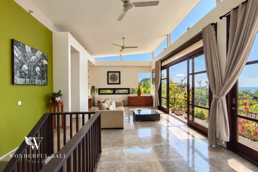 3BR villa for sale in Jimbaran — living room, upper living area with ocean views beyond the balcony