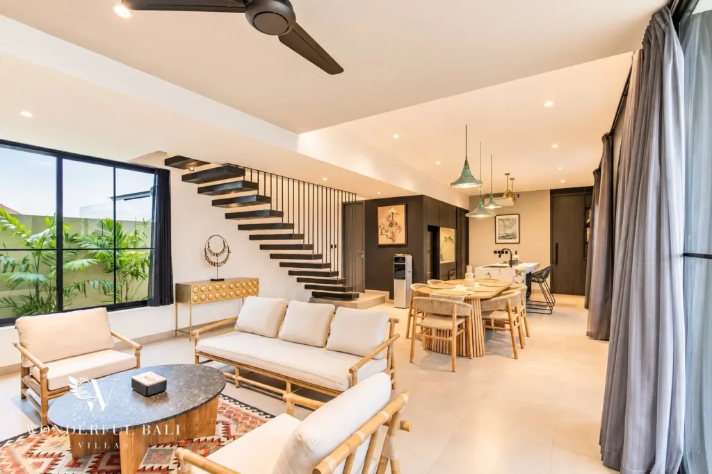 3BR villa for rent in Munggu — living and dining area with ceiling fan and pendant lights