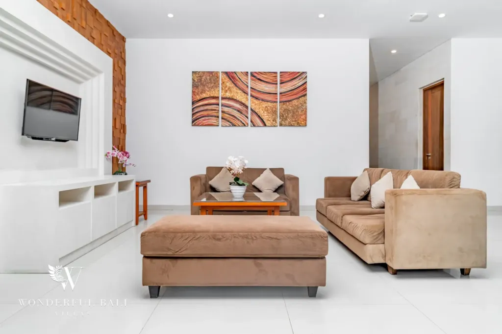 3BR villa for rent in Batu Belig, Seminyak — living room, open living room with the staircase and kitchen beyond