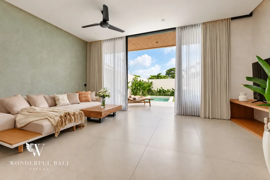 2BR villa for rent in Padonan, Canggu — living room, living room opening through glass doors to the pool
