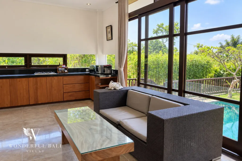 3BR villa for sale in Jimbaran — kitchen, lounge beside the kitchen with sliding doors to the pool