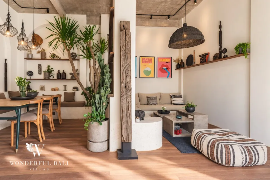 2BR villa for rent in Berawa, Canggu — living and dining, open-plan living and dining under exposed concrete beams