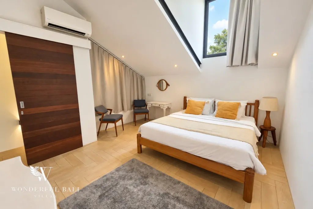 4BR villa for rent in Berawa, Canggu — bedroom, upstairs bedroom under a sloping ceiling