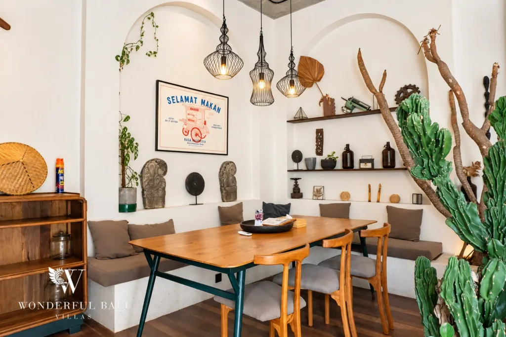 2BR villa for rent in Berawa, Canggu — dining and kitchen, teak dining table and open shelving beside the kitchen