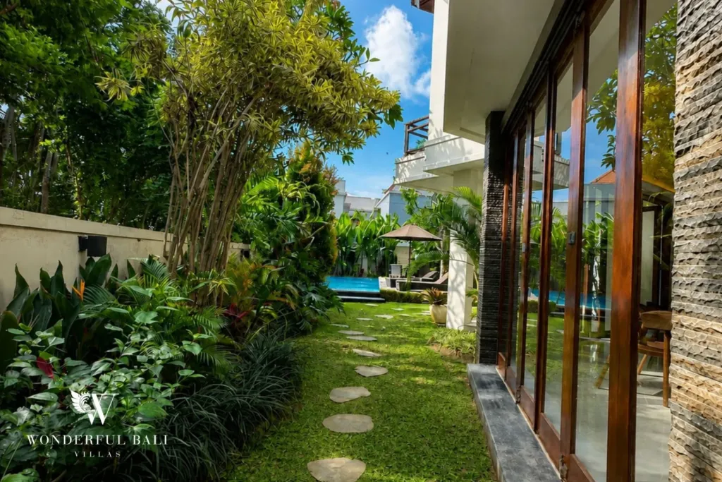 4BR villa for rent in Padonan, Canggu — garden, planted path running along the side of the villa