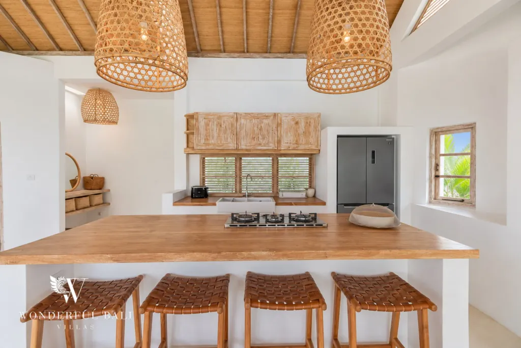 4BR villa for rent in Umalas, Bali — kitchen, kitchen island with a timber top and rattan bar stools