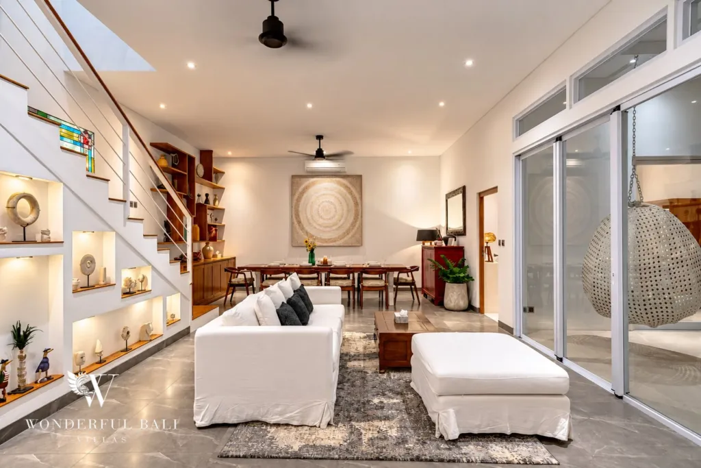 5BR villa for rent in Bumbak, Umalas — living room, living room looking through to the dining table and hanging egg chair