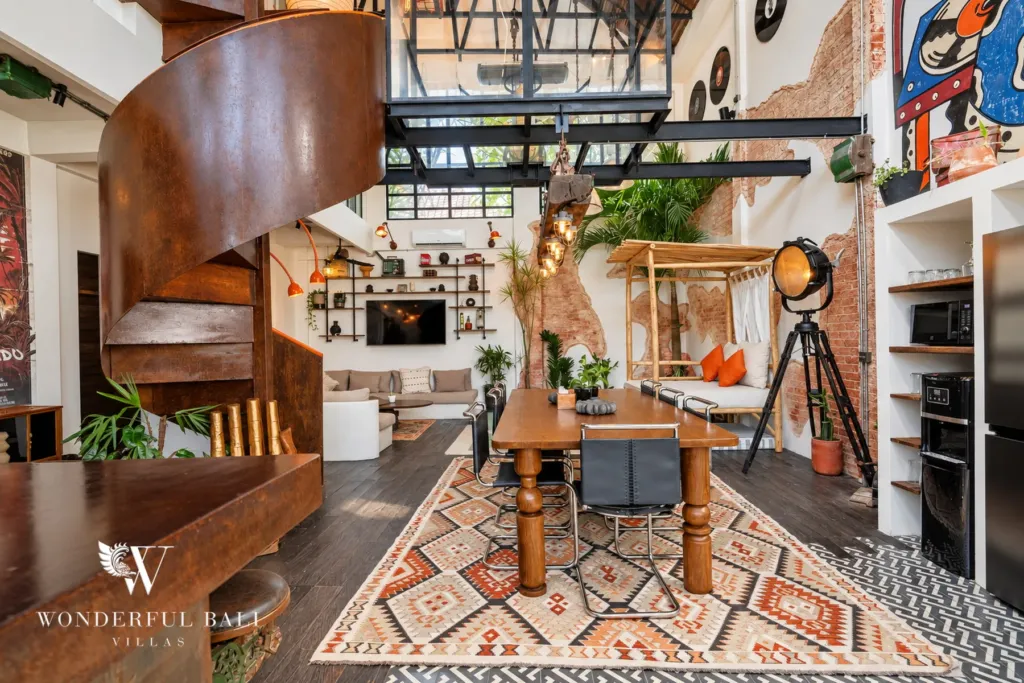 3BR villa for sale in Berawa — kitchen, spiral staircase, dining table and kitchen under the steel mezzanine