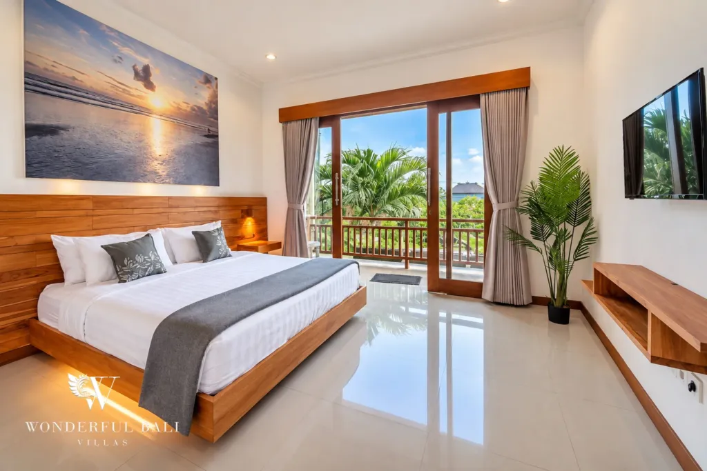 4BR villa for rent in Umalas, Bali — bedroom, backlit teak headboard wall and its own balcony