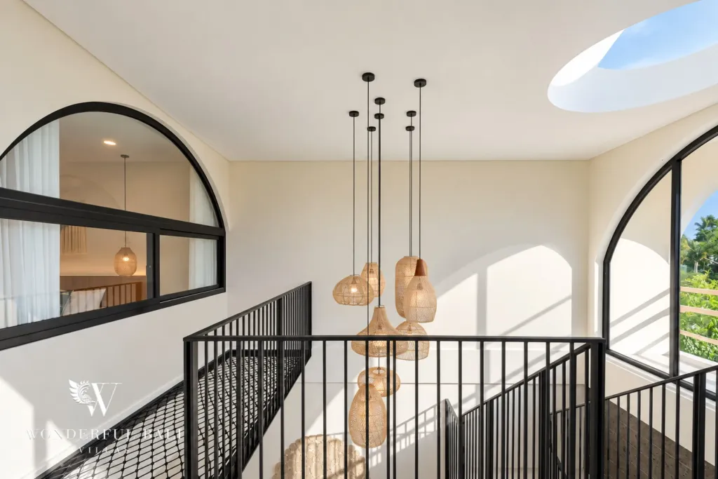 3BR villa for rent in Berawa, Canggu — interior, upper landing with rattan pendants over the void