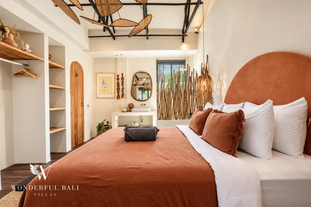 3BR villa for sale in Berawa — bedroom, bedroom with open shelving and an arched timber door