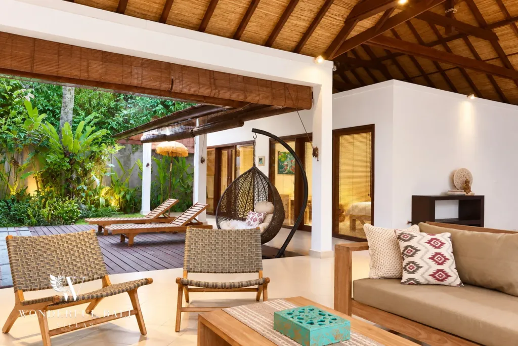 3BR villa for rent in Padonan, Canggu — terrace, covered terrace lounge with hanging chair and loungers by the pool