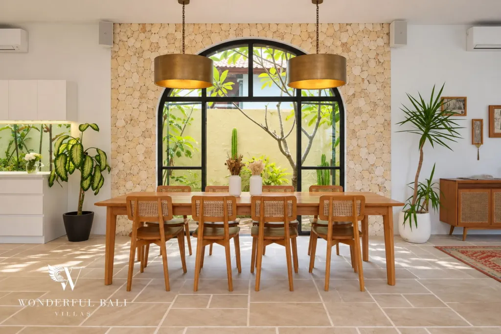 5BR villa for rent in Seseh, Bali — dining area, long timber table for ten under woven drum pendants