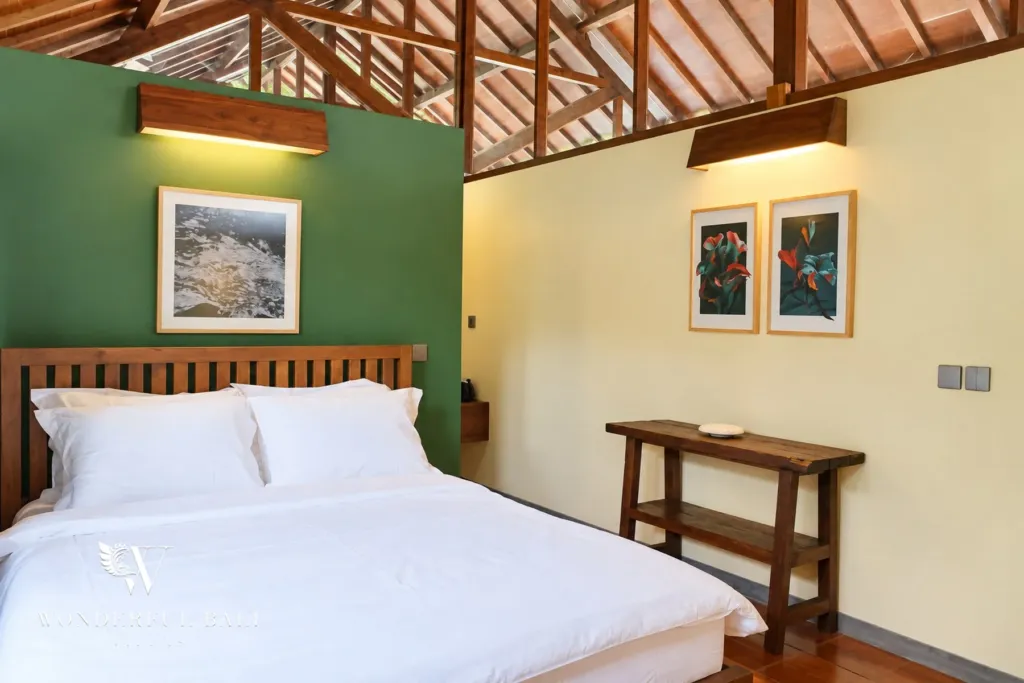2BR villa for rent in Seseh — second bedroom with desk and framed prints