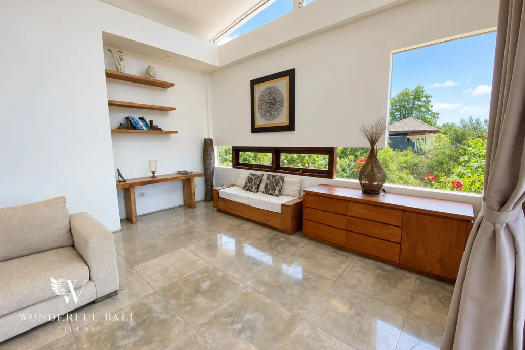 3BR villa for sale in Jimbaran — living room, built-in daybed and timber sideboard under clerestory windows