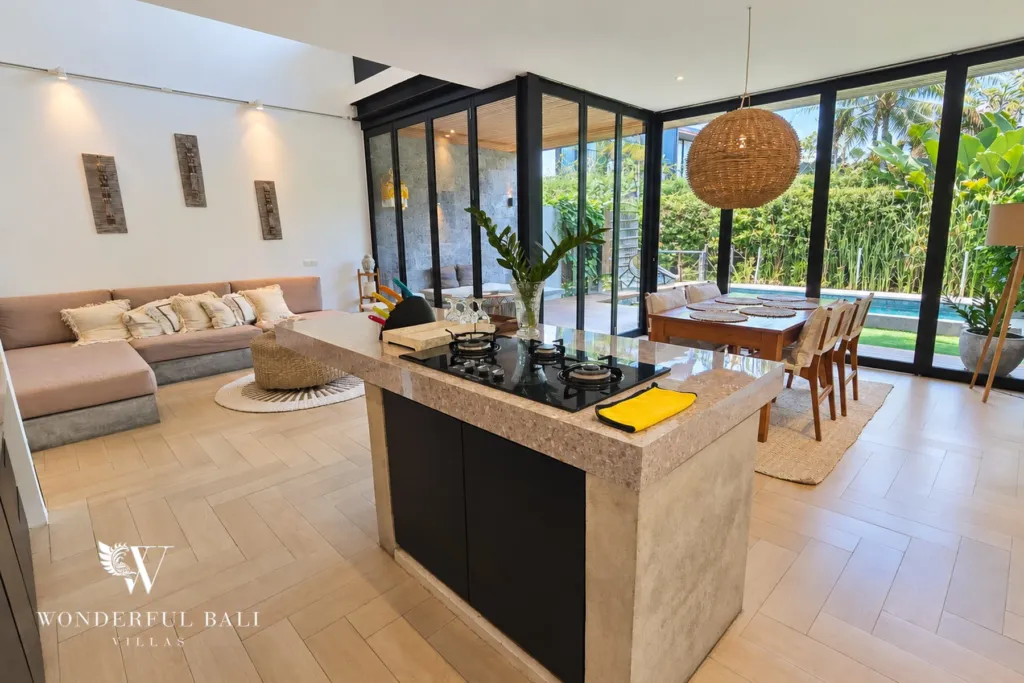 4BR villa for rent in Berawa, Canggu — living room, living and dining with the kitchen island between