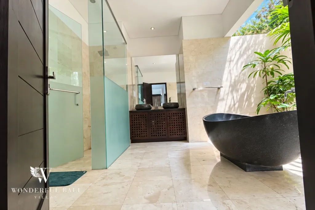 4BR villa for rent in Umalas, Bali — bathroom, en-suite bathroom with a walk-in shower and stone vanity