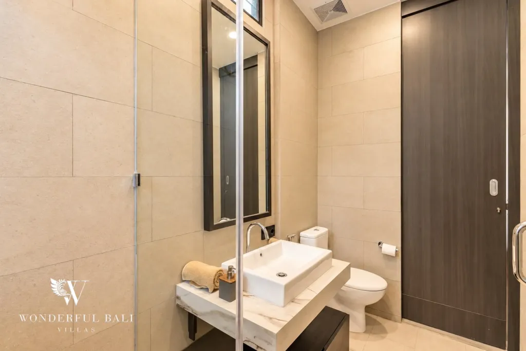 3BR villa for rent in Munggu — bathroom with vanity and glass shower