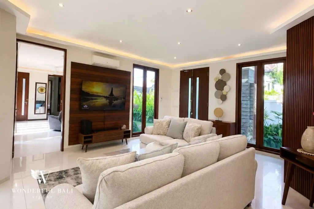 4BR villa for rent in Padonan, Canggu — living room, seating area with artwork and garden doors