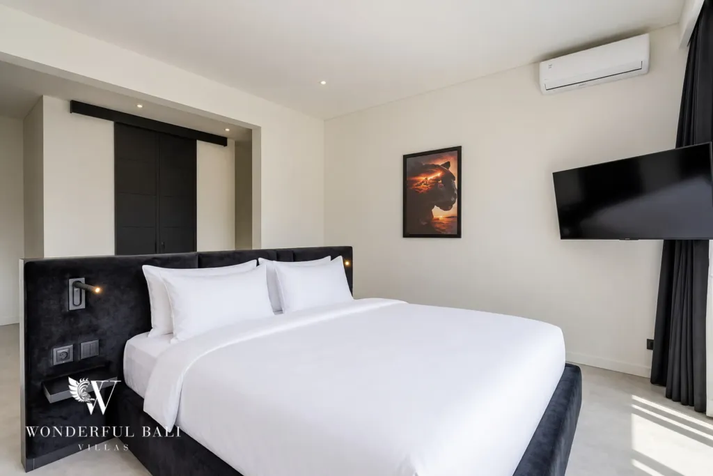 3br villa for sale umalas — guest bedroom with an integrated headboard and a sliding door through to its bathroom
