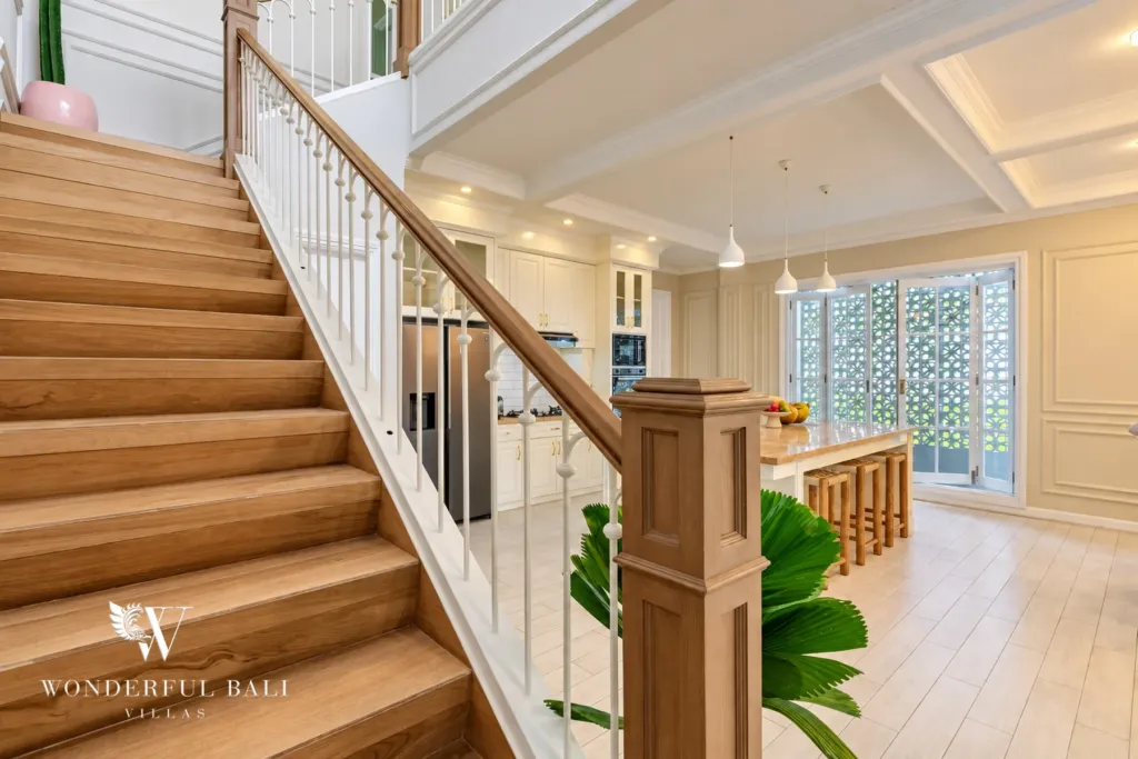 5BR villa for sale in Pererenan — timber staircase beside the open kitchen