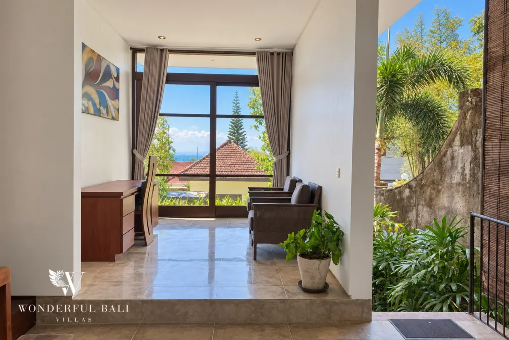 3BR villa for sale in Jimbaran — workspace, reading nook with a desk and armchairs by a tall window