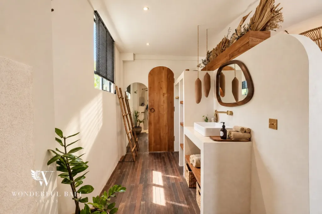 3BR villa for sale in Berawa — bathroom, vanity hallway with an arched timber door