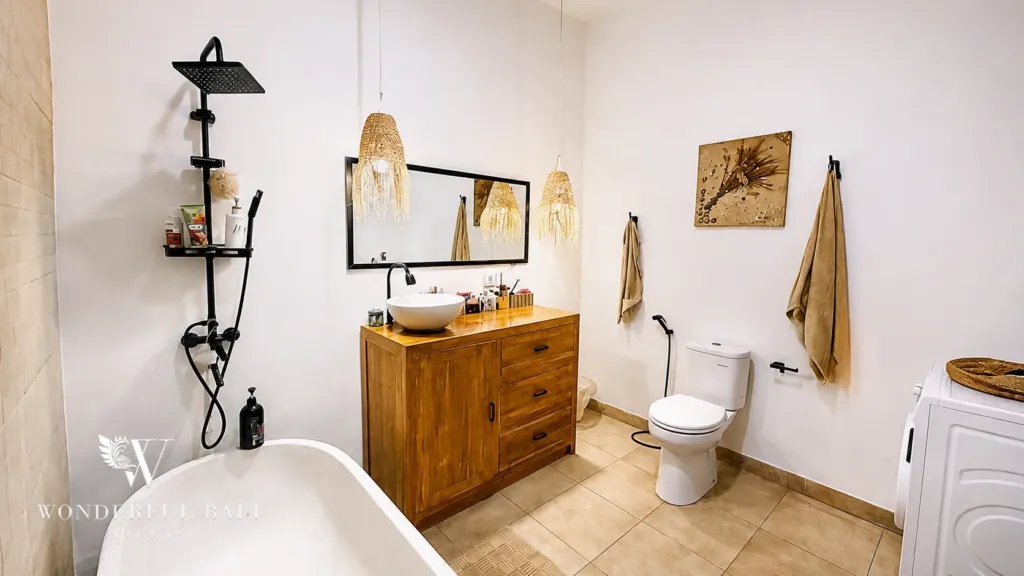 3BR villa for rent in Umalas — bathroom 3, freestanding tub, timber vanity and washing machine