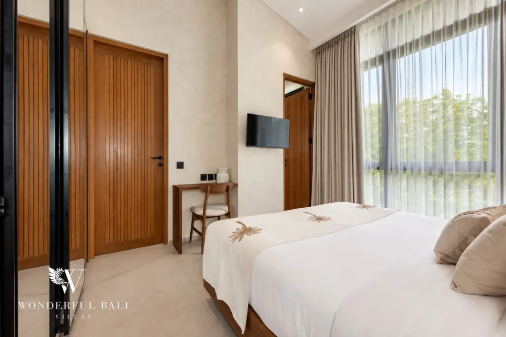 2BR villa for rent in Padonan, Canggu — bedroom, bedroom with a wall-mounted TV and desk