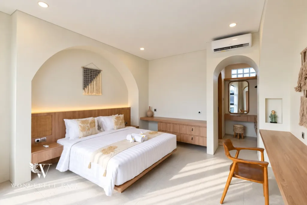 3BR villa for rent in Berawa, Canggu — bedroom, bedroom with an arched alcove, timber ledge and en-suite doorway