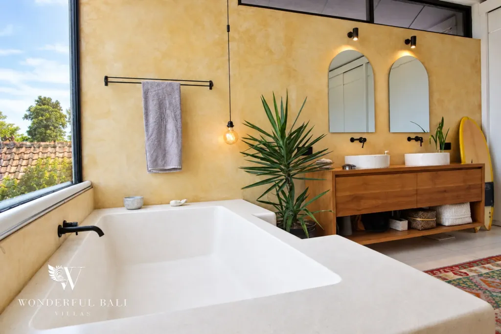 5BR villa for rent in Seseh, Bali — bathroom, twin basins on a timber vanity beside a freestanding tub