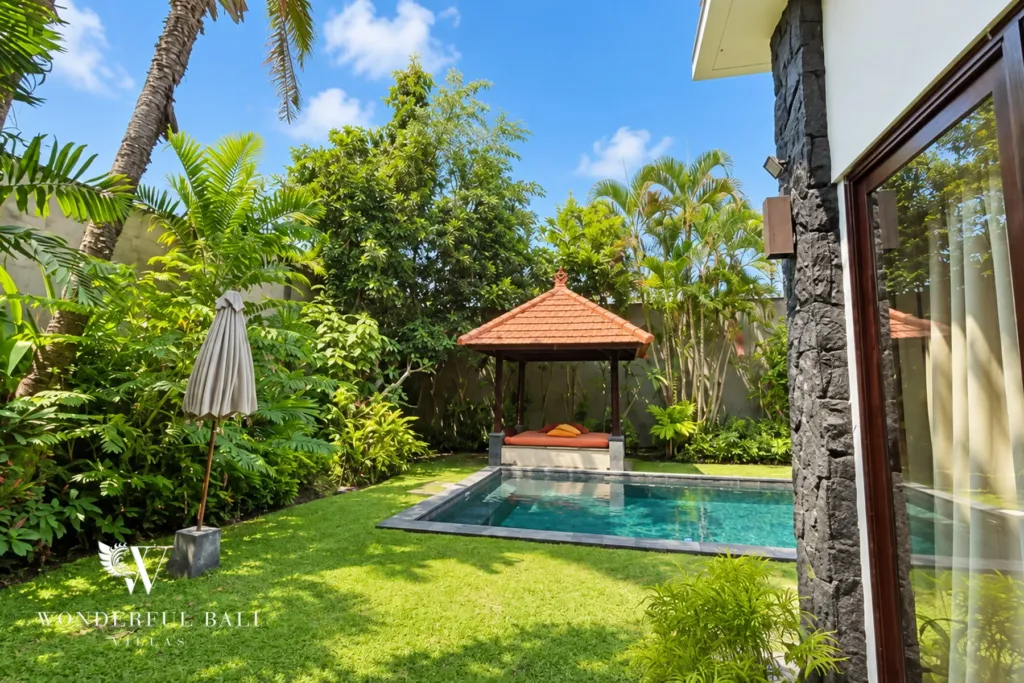 4BR villa for rent in Umalas, Bali — garden, mature tropical garden around the lap pool and thatched bale