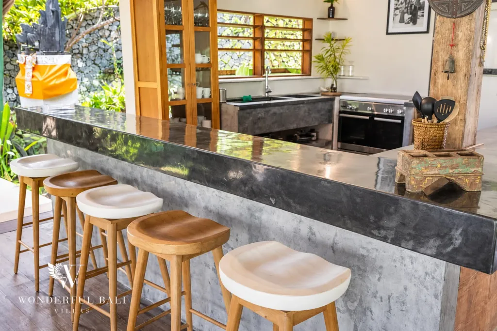 5BR villa for rent in Umalas — kitchen, breakfast bar with teak stools and a black-stone top