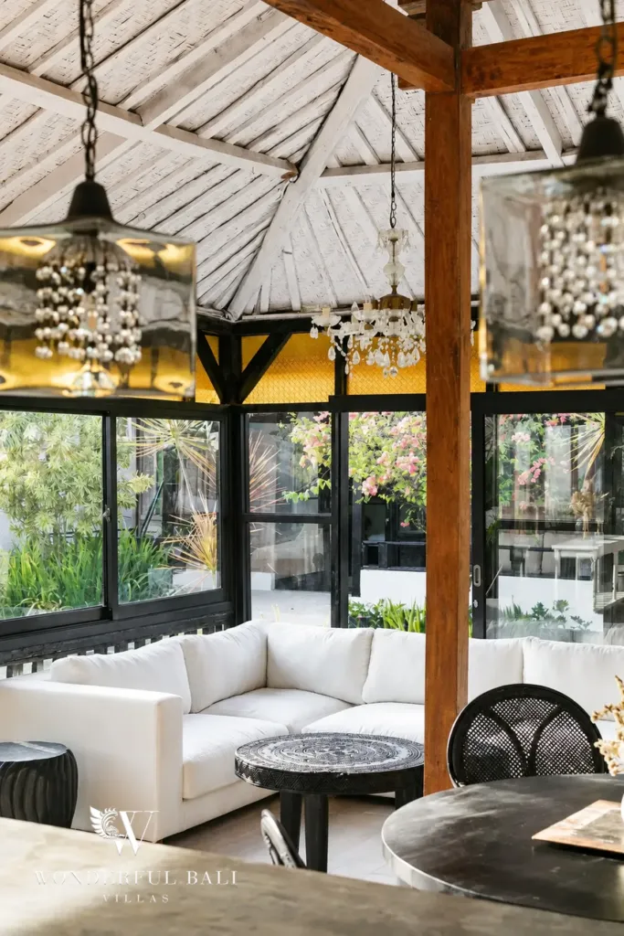 3BR villa for rent in Berawa, Canggu — living room, white sofas and carved side tables