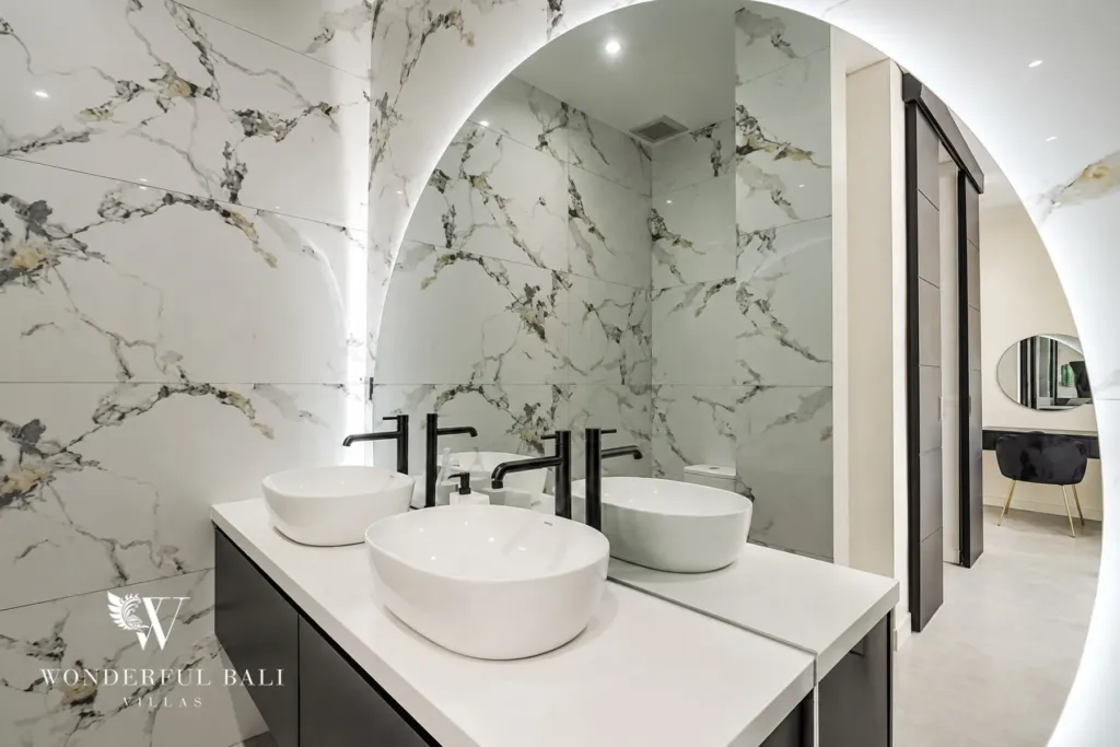 3br villa for sale umalas — white marble master bathroom with twin basins a backlit arched mirror and a dressing area