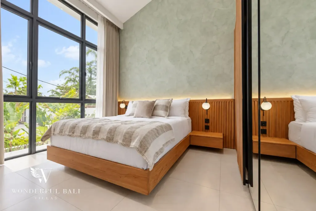 2BR villa for rent in Padonan, Canggu — bedroom, second bedroom with a sage wall and garden view