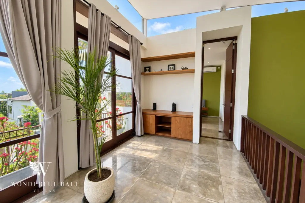 3BR villa for sale in Jimbaran — landing, bright upper landing with built-in shelving and garden views