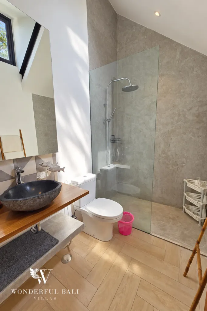 4BR villa for rent in Berawa, Canggu — bathroom, bathroom with a stone basin and walk-in shower