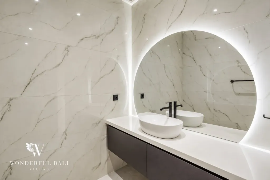 3br villa for sale umalas — marble bathroom with a backlit round mirror and a floating stone vanity