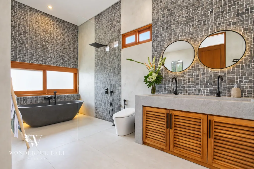 4BR villa for rent in Cemagi — bathroom, stone bathtub, rain shower and double vanity