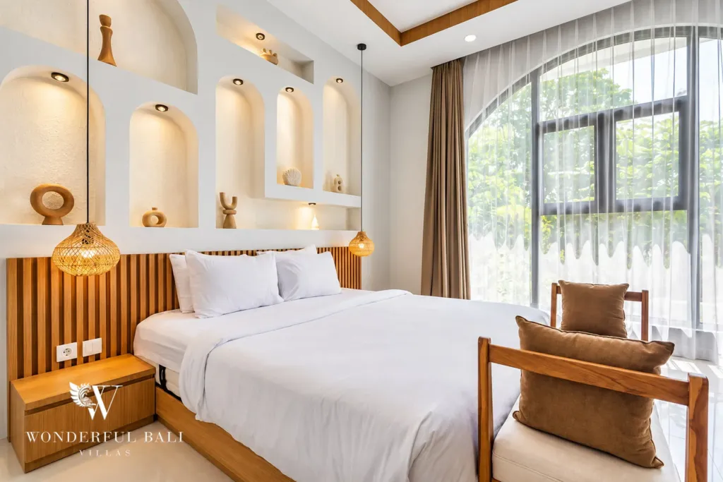3BR villa for rent in Umalas, Bali — bedroom, fluted timber headboard with built-in lighting and side shelves