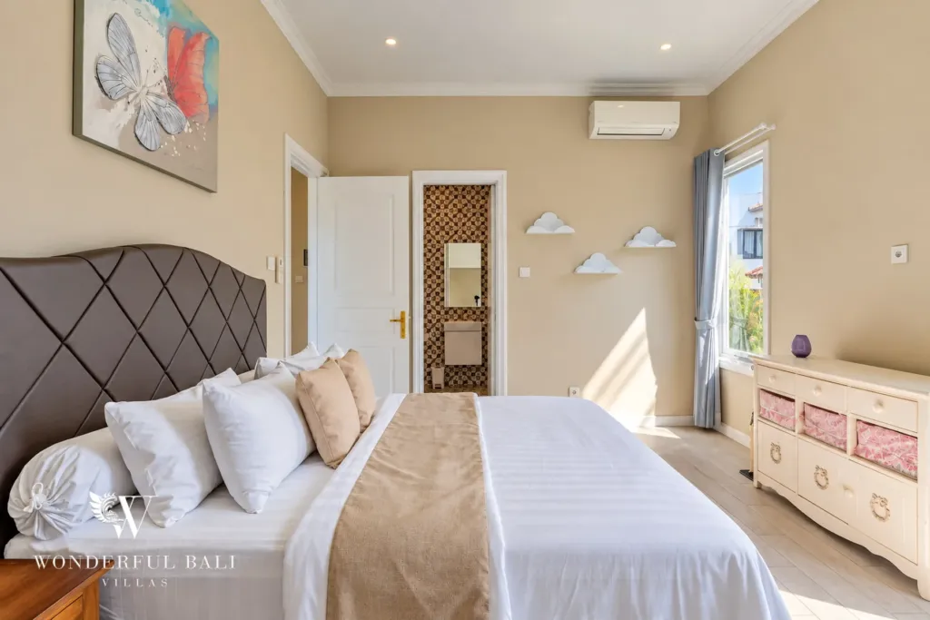 5BR villa for sale in Pererenan — guest bedroom with padded headboard and en-suite