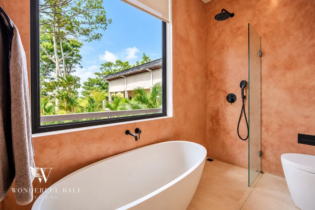 5BR villa for rent in Seseh, Bali — bathroom, ochre plaster bathroom with a freestanding tub and open shower