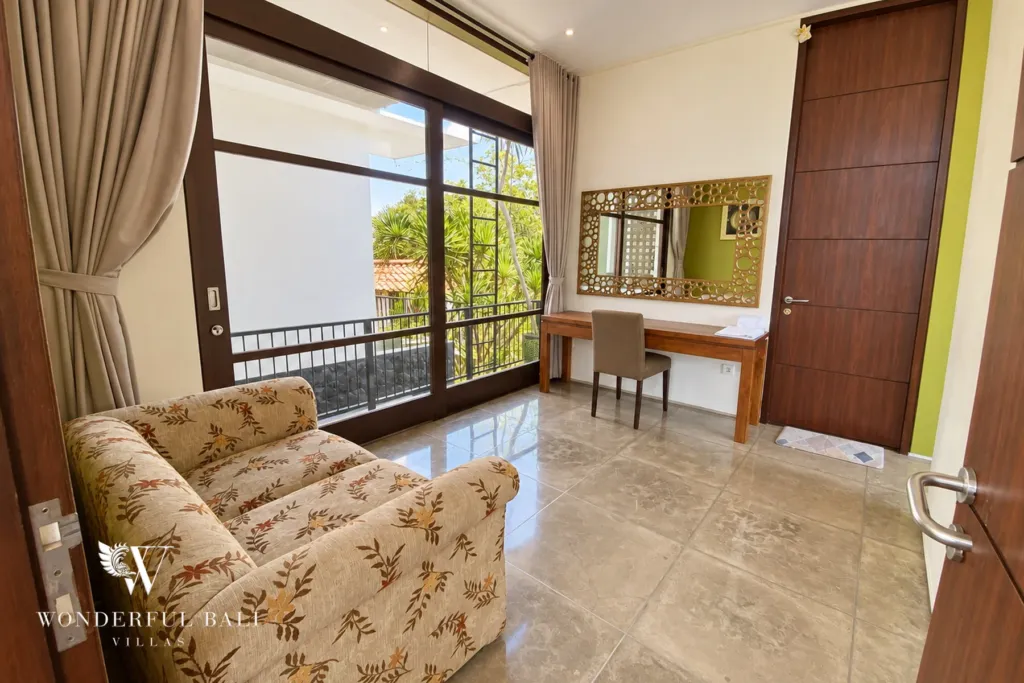 3BR villa for sale in Jimbaran — bedroom, bedroom sofa and dressing table beside balcony doors