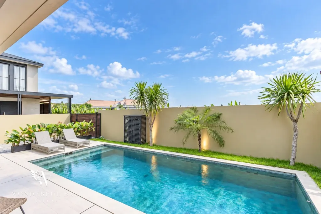 3BR villa for rent in Munggu — private pool with loungers and garden wall