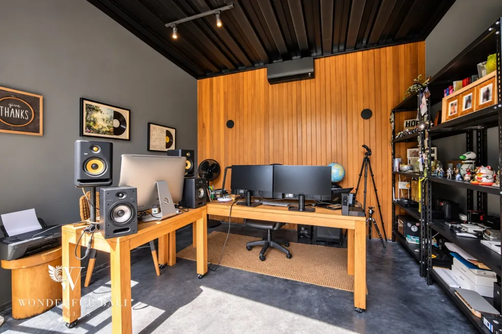 5BR villa for rent in Seseh, Bali — studio room, timber-lined room currently set up as a studio with desks