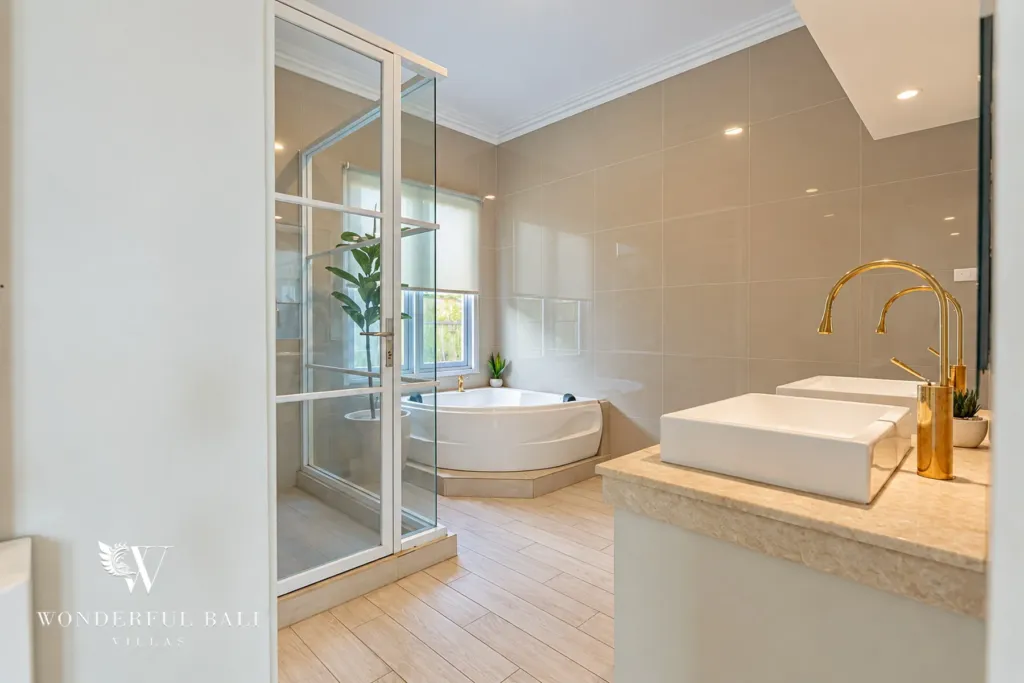 5BR villa for sale in Pererenan — bathroom with corner bathtub and glass shower