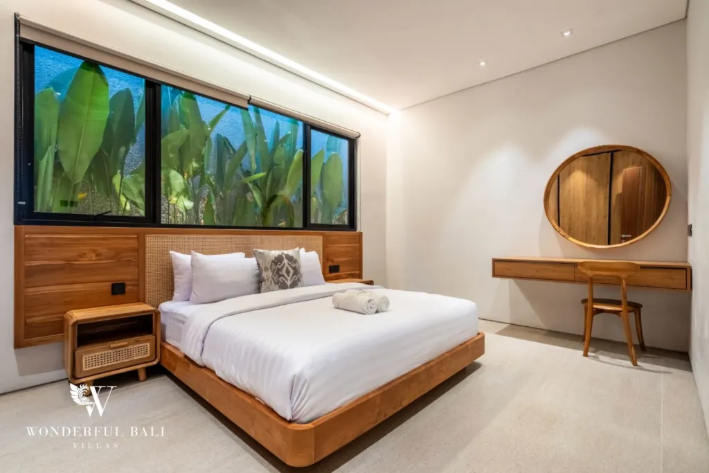 3BR villa for rent in Seminyak — bedroom 3, desk and round mirror beside the window