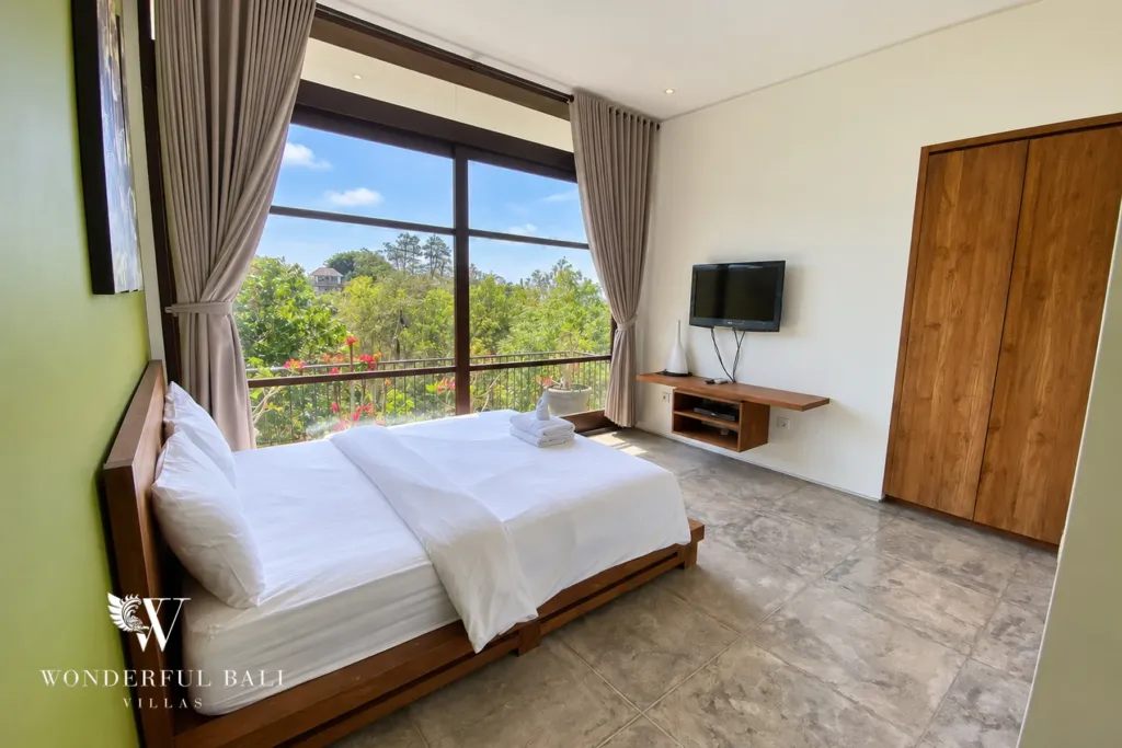 3BR villa for sale in Jimbaran — bedroom, bedroom with a timber wardrobe and treetop views