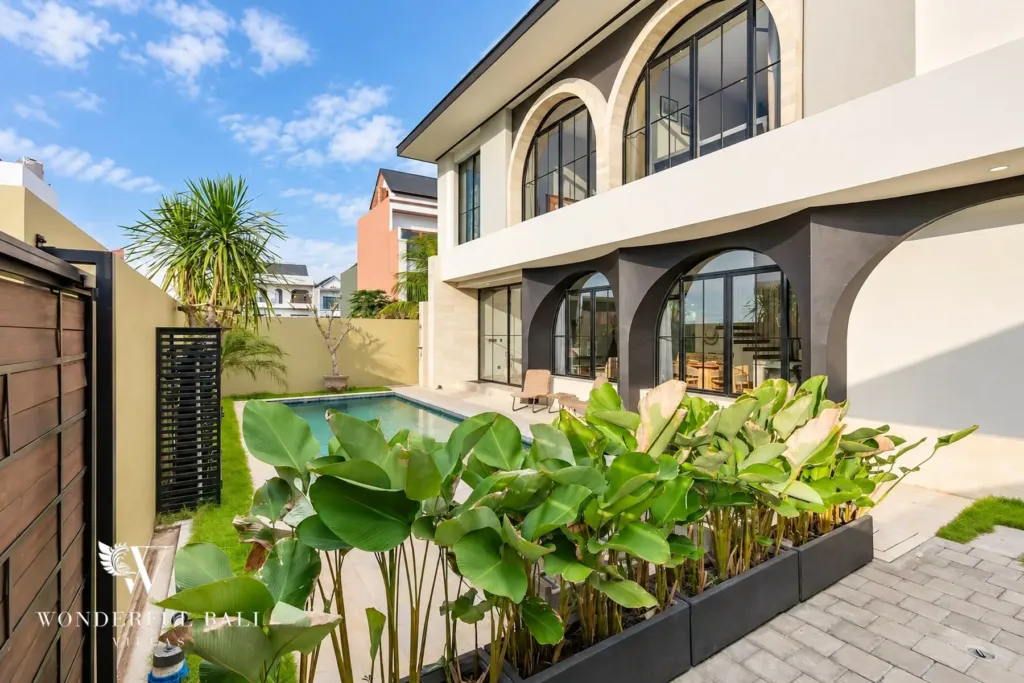 3BR villa for rent in Munggu — villa exterior with arches and planted garden